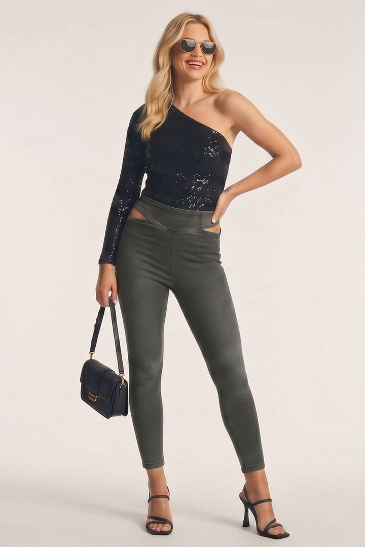 Woman modeling a black one-shoulder top and gray pants from different angles on a white background.