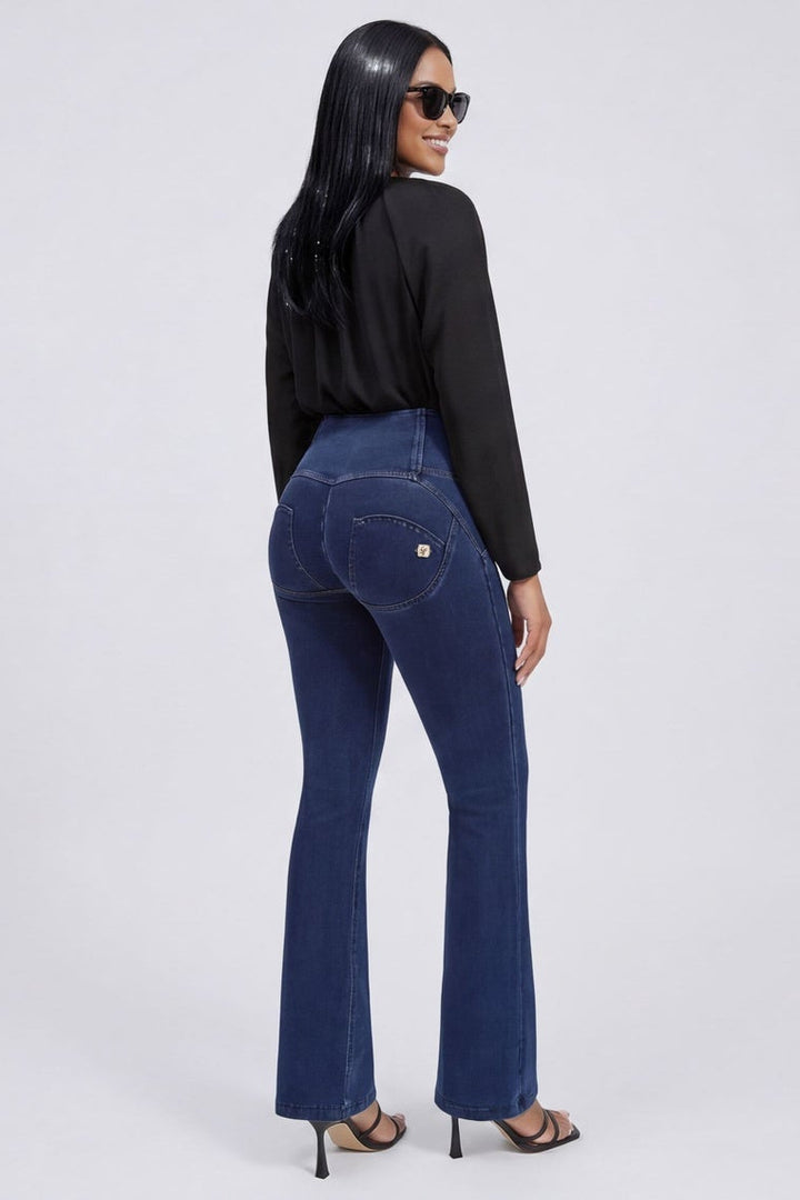 Woman wearing blue jeans and a black top, shown from front and back on a white background