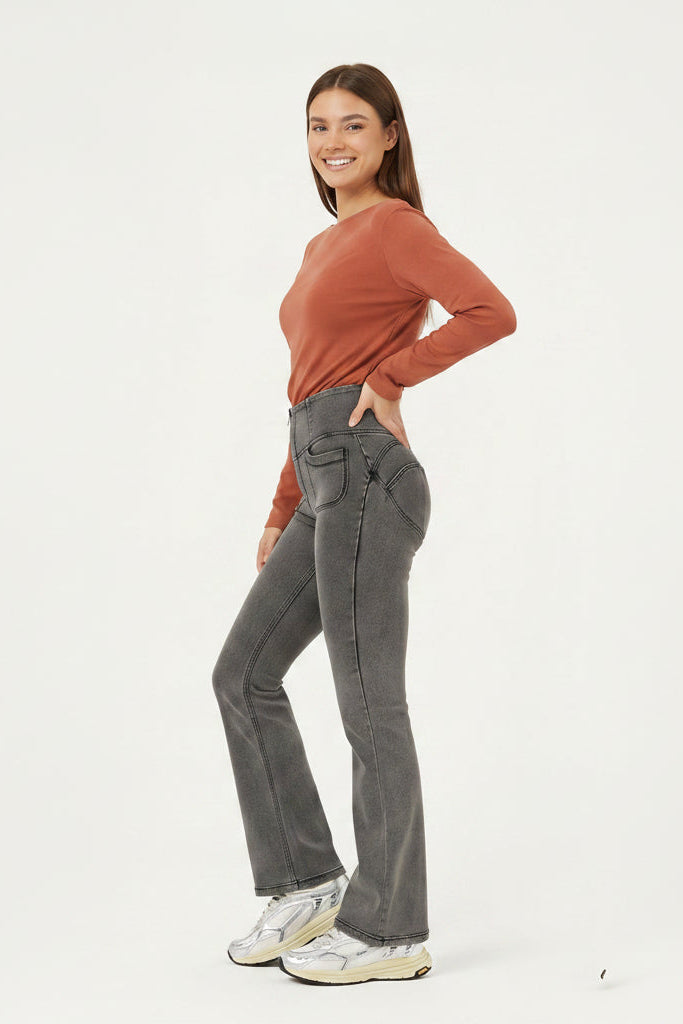 Woman wearing a rust-colored long-sleeve top and gray jeans in three different poses on a white background.