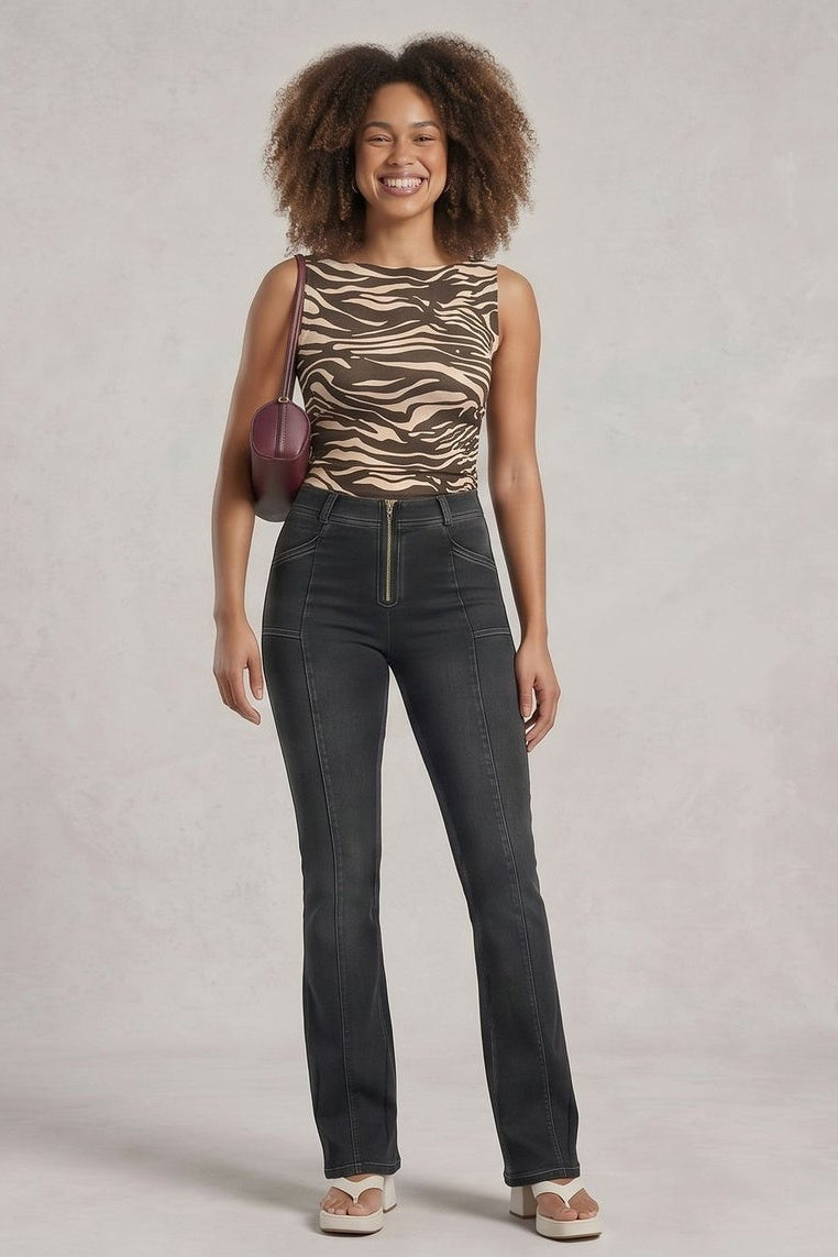 Woman wearing a zebra print top and dark jeans, shown from front and back on a plain background.