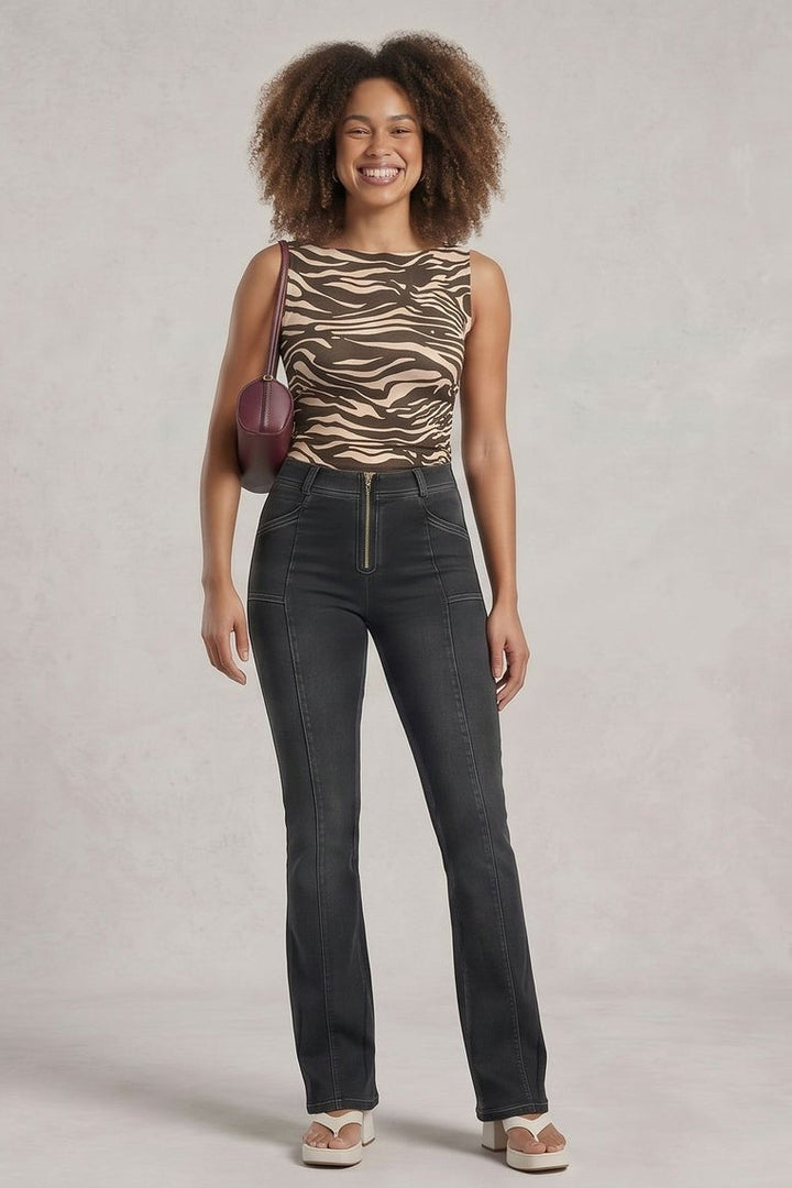 Woman wearing a zebra print top and dark jeans, shown from front and back on a plain background.