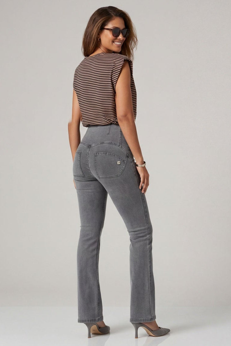 Woman wearing gray jeans and a brown top, shown from front and back on a plain background