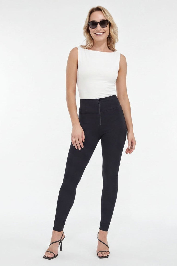 Woman wearing black leggings and a white top, shown from front and side views on a white background.