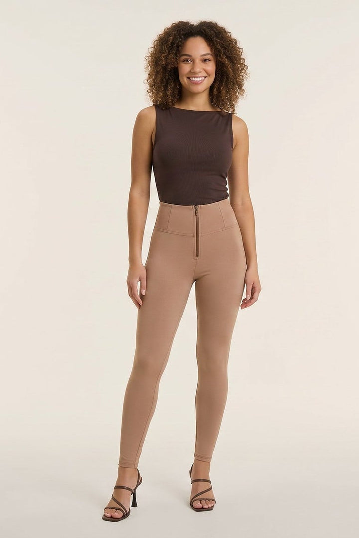 Woman wearing a brown sleeveless top and beige pants, facing front and back, on a white background.