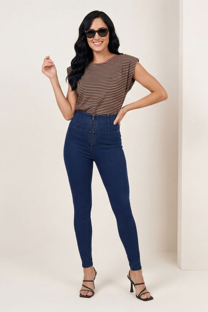 Woman wearing blue jeans and a brown top in two different poses against a white background