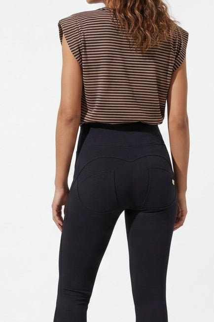 Woman wearing a brown sleeveless top and black pants, shown from front and back on a white background.