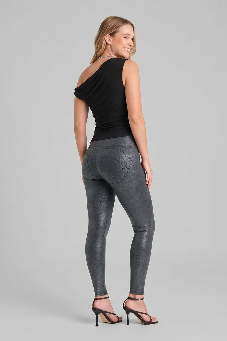 Woman wearing black top and gray leggings from different angles on a gray background