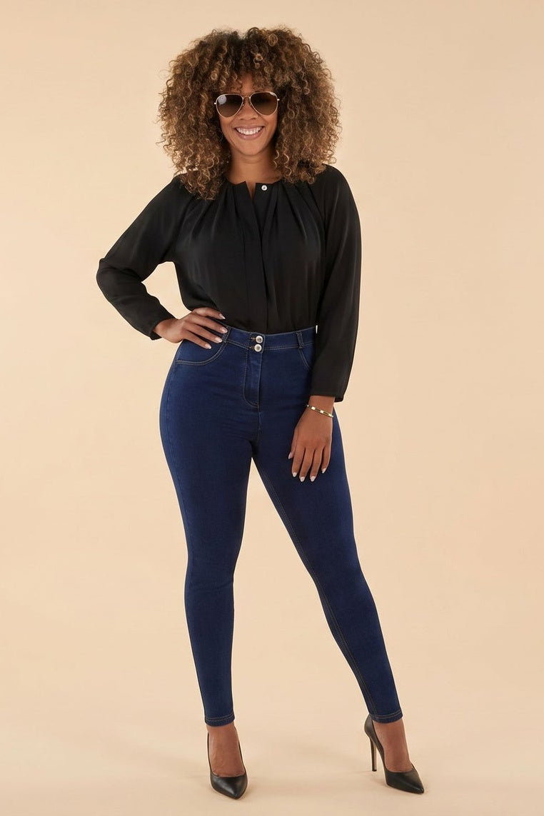 Woman wearing blue jeans and a black top, shown from front and back on a beige background