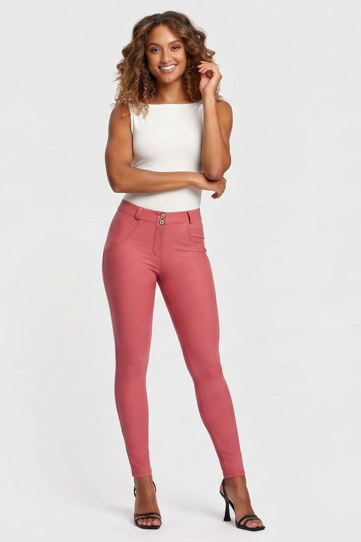 Woman wearing pink pants on a white background