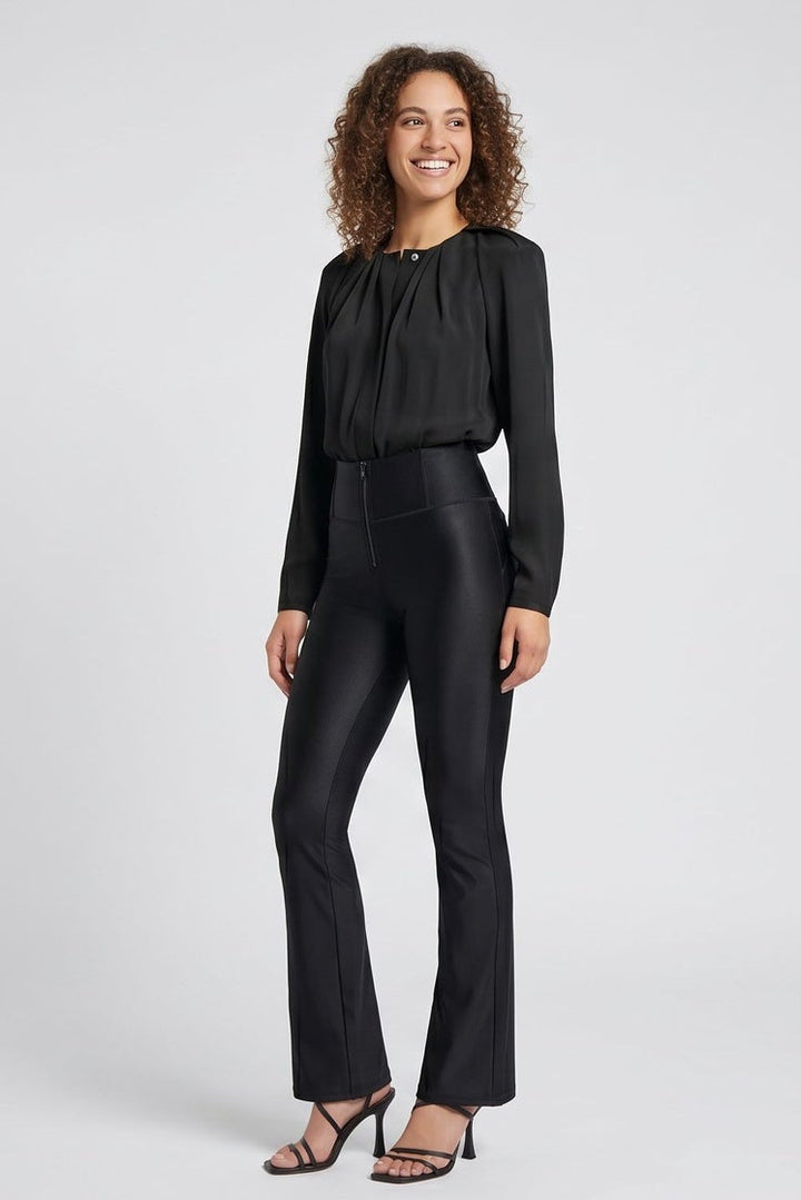 Woman wearing a black suit with front and back views on a white background