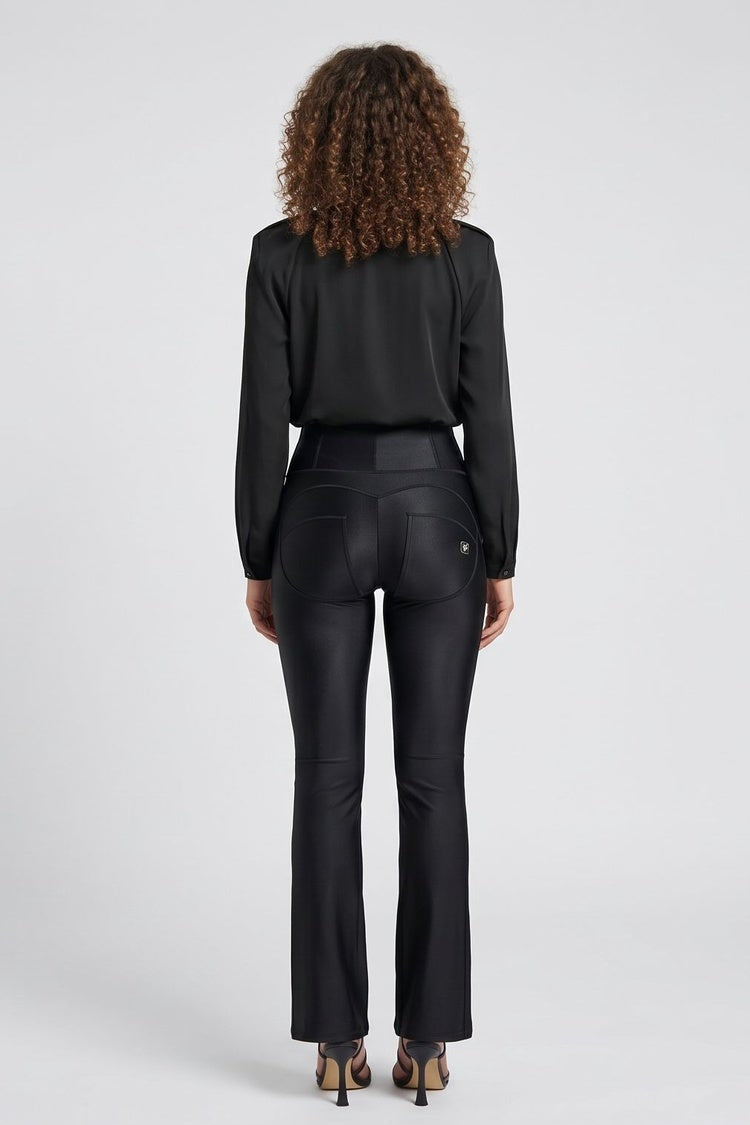 Woman wearing a black suit with front and back views on a white background