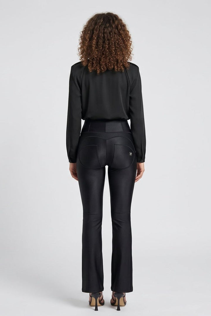 Woman wearing a black suit with front and back views on a white background