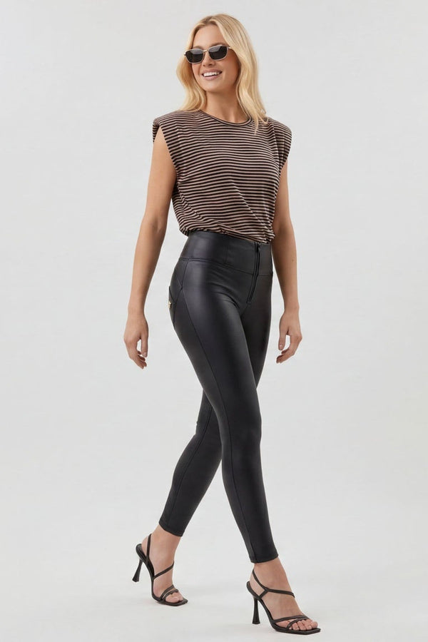 Woman modeling black leather leggings from front and back views on a white background