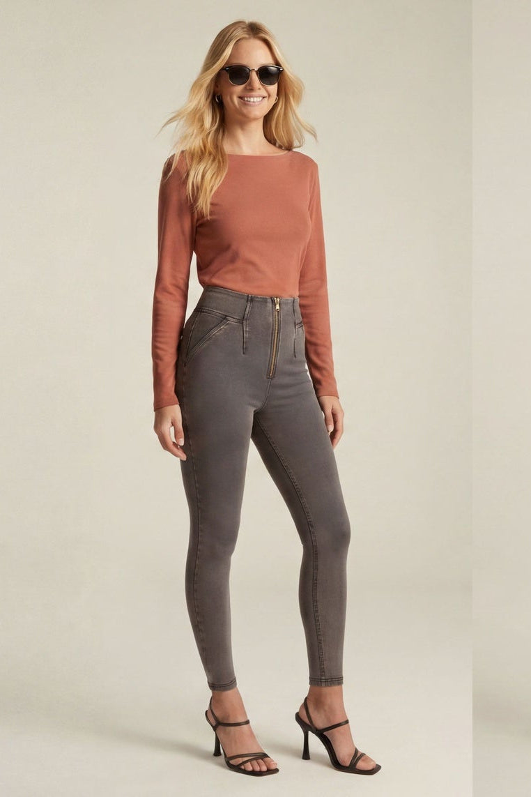 Woman wearing a rust-colored top and gray jeans, shown from front and back on a beige background.