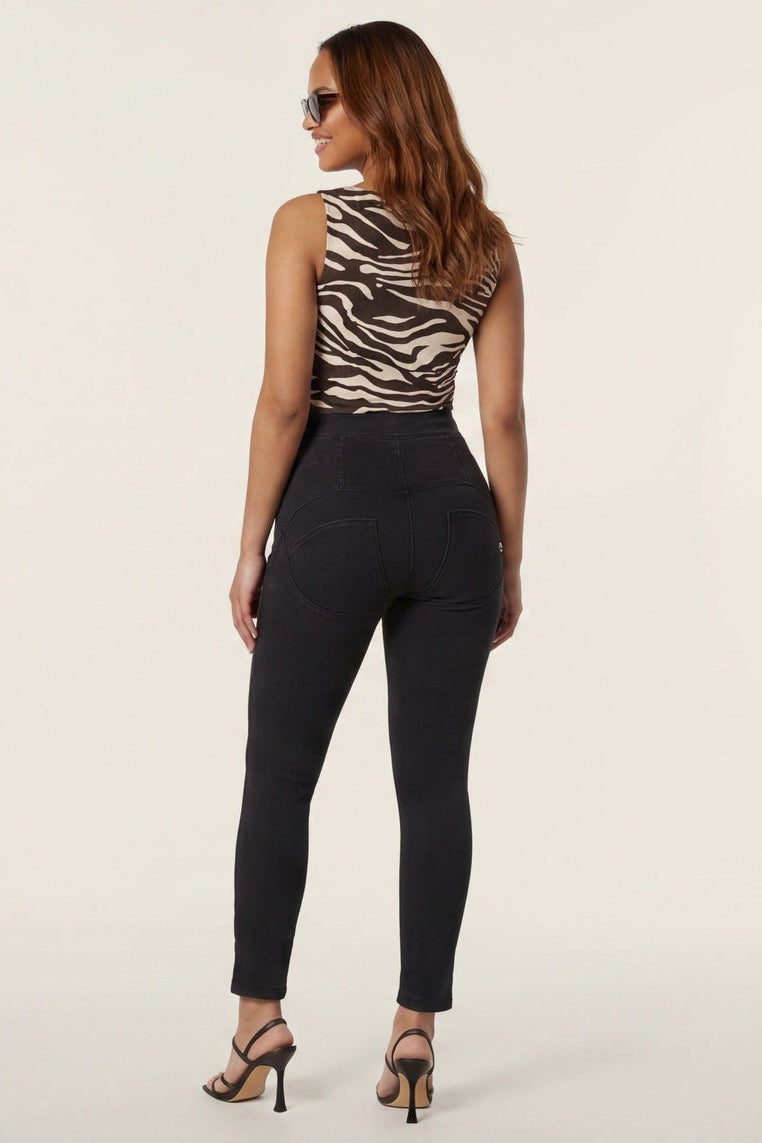 Woman wearing a zebra print top and black pants, shown from front and back on a white background.