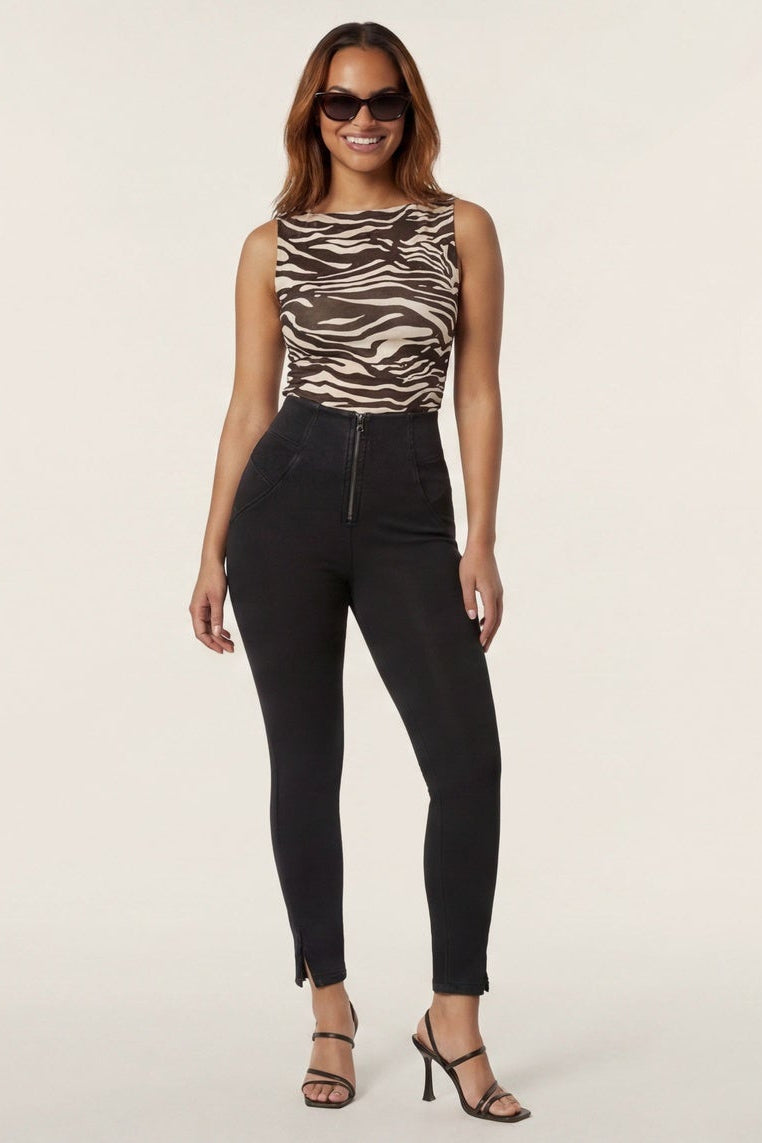 Woman wearing a zebra print top and black pants, shown from front and back on a white background.