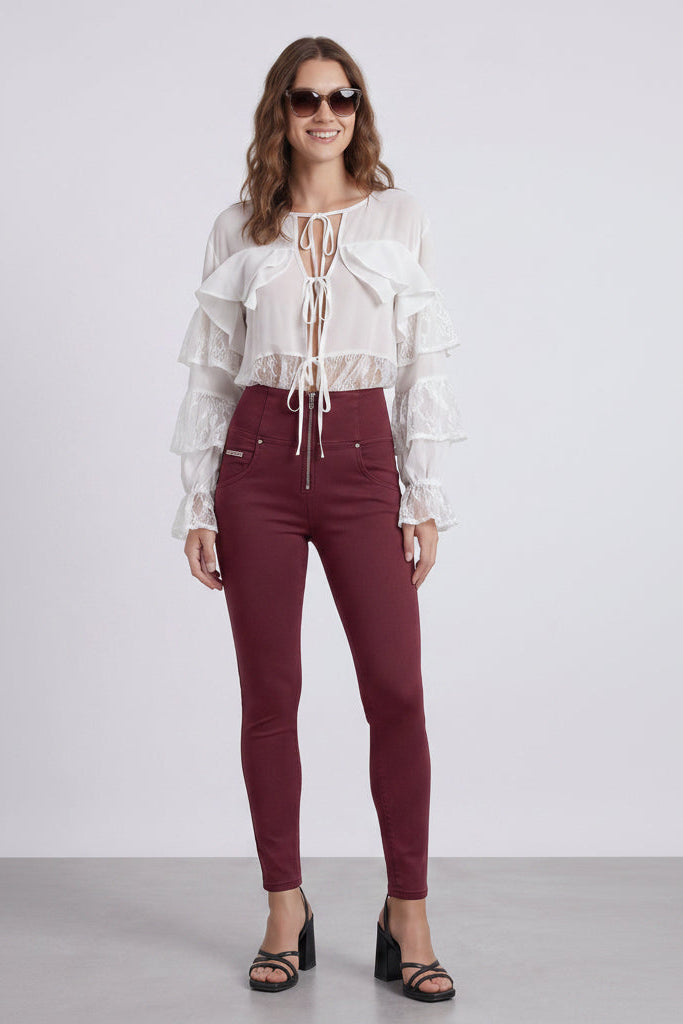 Woman wearing a white blouse and maroon pants, shown from front and back on a white background.