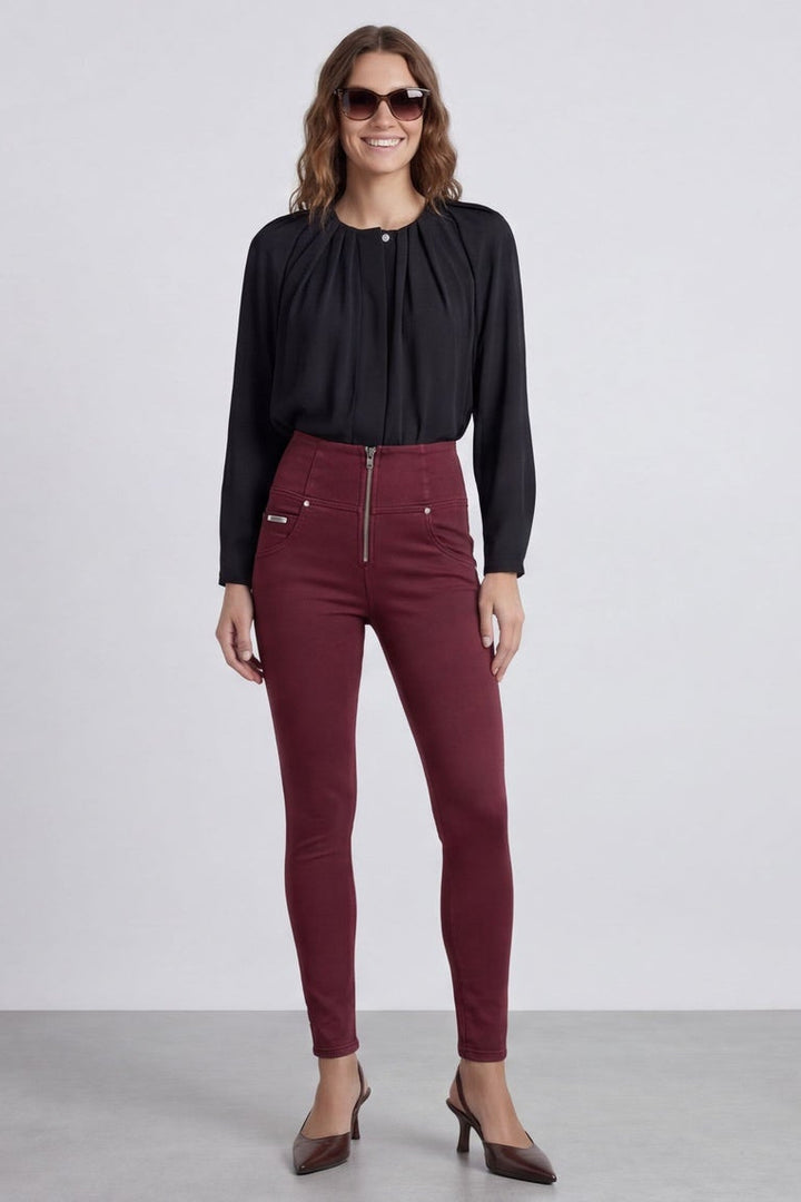 Woman wearing maroon pants and a black top, shown from front and back on a white background.