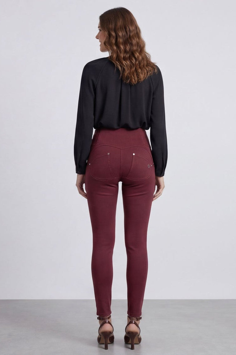 Woman wearing maroon pants and a black top, shown from front and back on a white background.