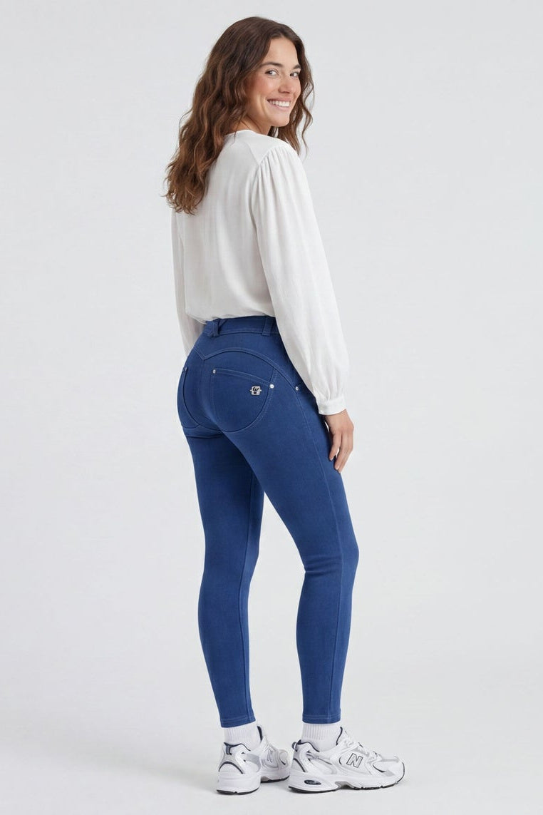 Woman wearing blue jeans and a white shirt, shown from front and back on a white background