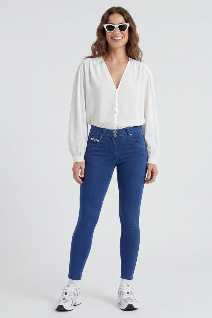 Woman wearing blue jeans and a white shirt, shown from front and back on a white background