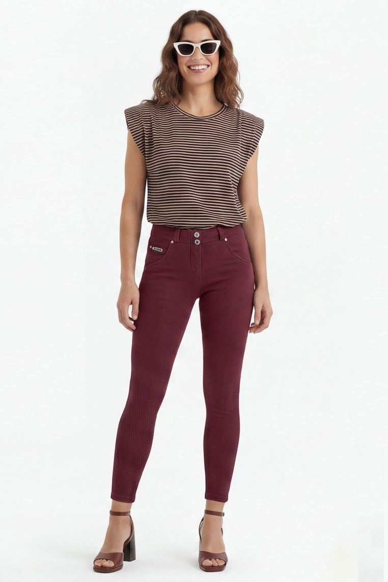 Woman wearing maroon pants and a brown top, shown from front, side, and back views on a white background.