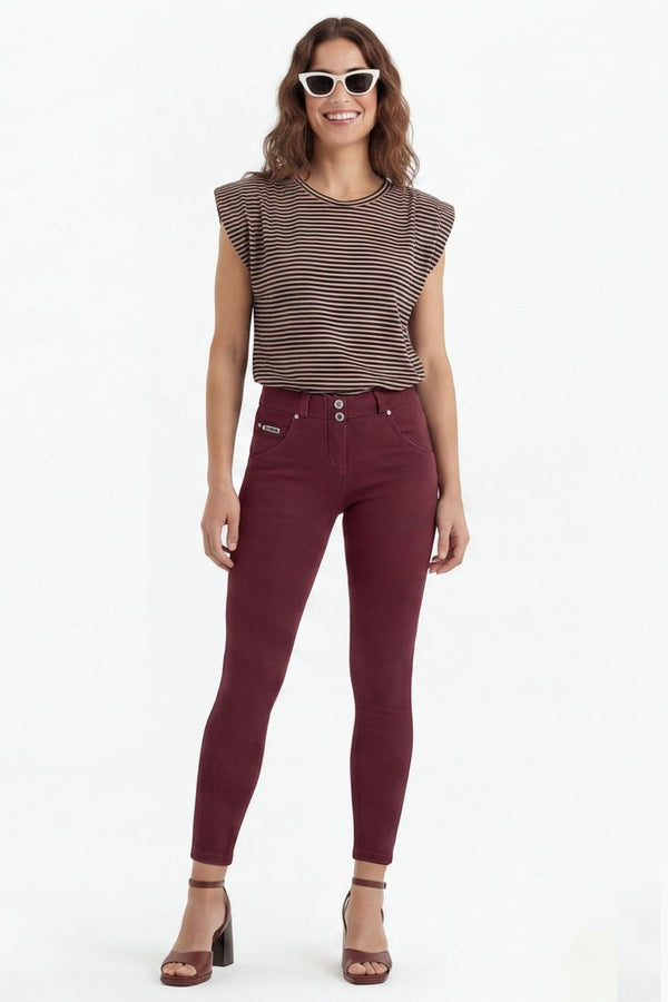 Woman wearing maroon pants and a brown top, shown from front, side, and back views on a white background.