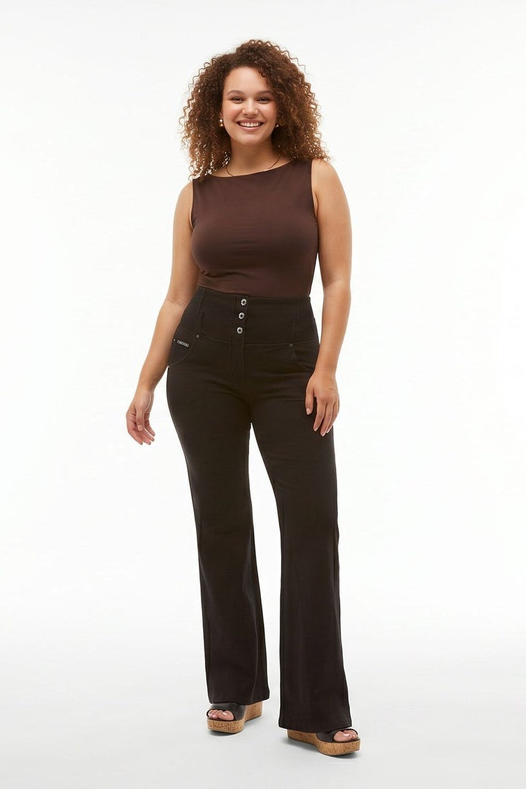 Woman wearing a brown sleeveless top and black pants on a white background