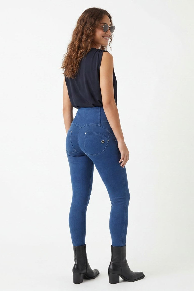 Woman wearing blue jeans and a black top, shown from front and side views on a white background.